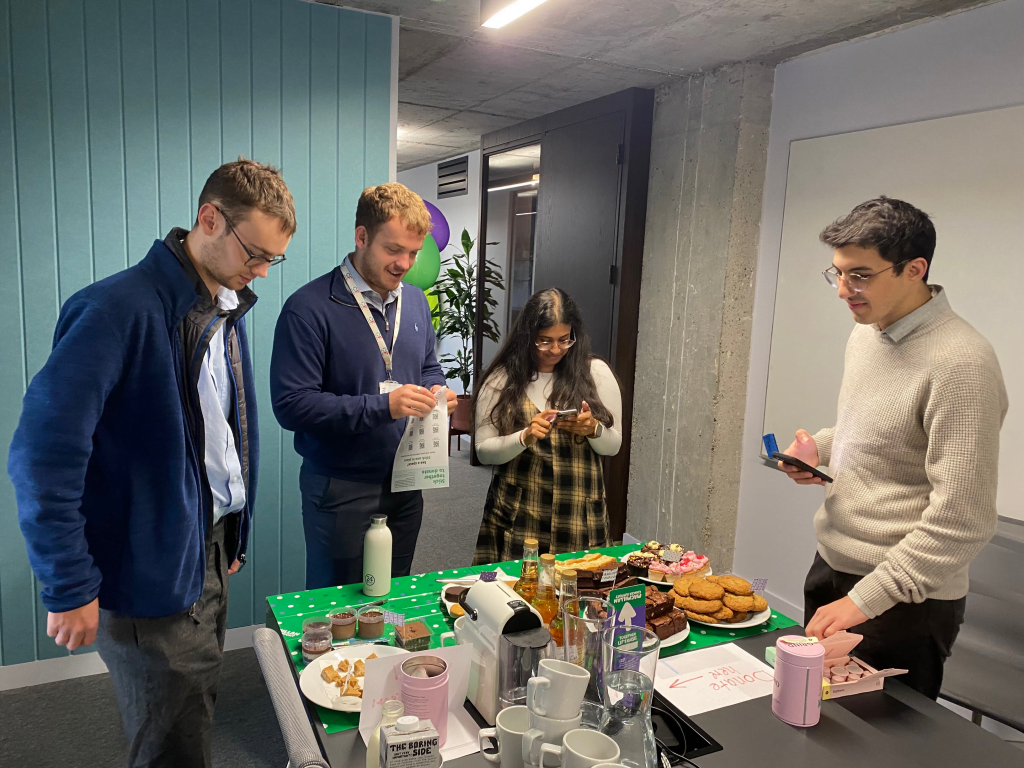 Employees enjoying Macmillan Coffee Morning